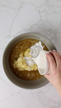 add bananas, almond milk, and whisk
