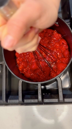 mush raspberries with whisk