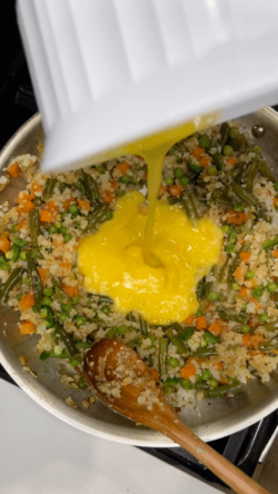 Create well and add in scrambled eggs.