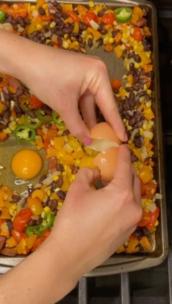 Spray with non-stick spray and gently crack in eggs