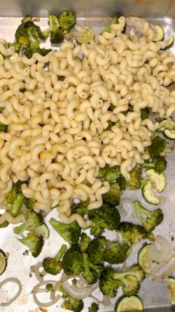 Once pasta is cooked, drain and add to pan with cooked veggies