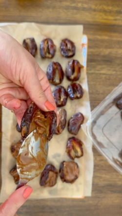 Once pits are removed, stuff each date with a little almond butter. About ¼-½ tsp depending on the size of the date. You do not want to overstuff these or it will be messy!