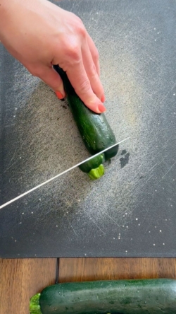 Chop off zucchini tops and bottoms
