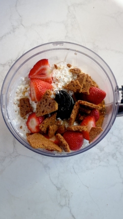 In a blender or food processor, add cottage cheese, maple syrup, and strawberries. Blend until smooth.