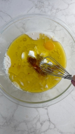 Add wet ingredients to a large mixing bowl and mix.
