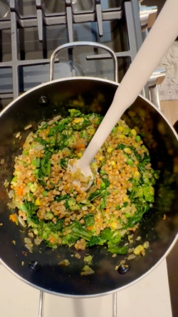 Add the broccoli, frozen veggie medley, lentils, and kale to the pot and stir