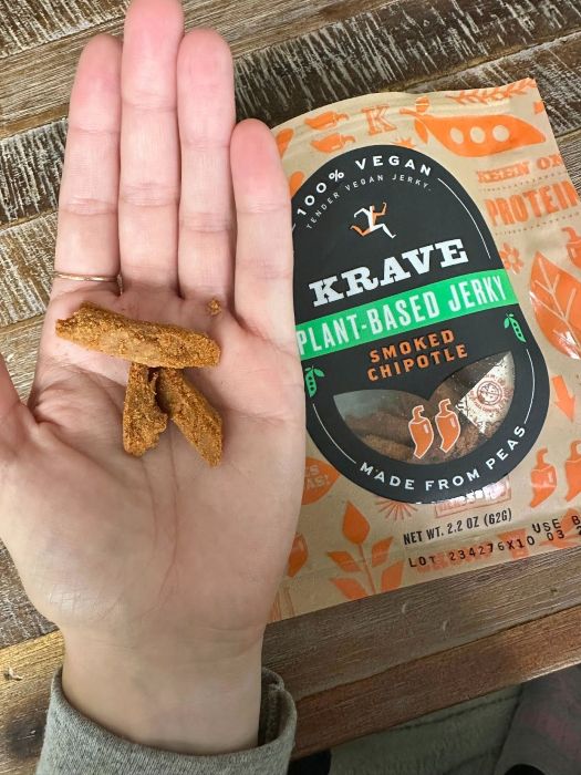 Pieces of KRAVE: Best Vegan Jerky in front of packaging. 