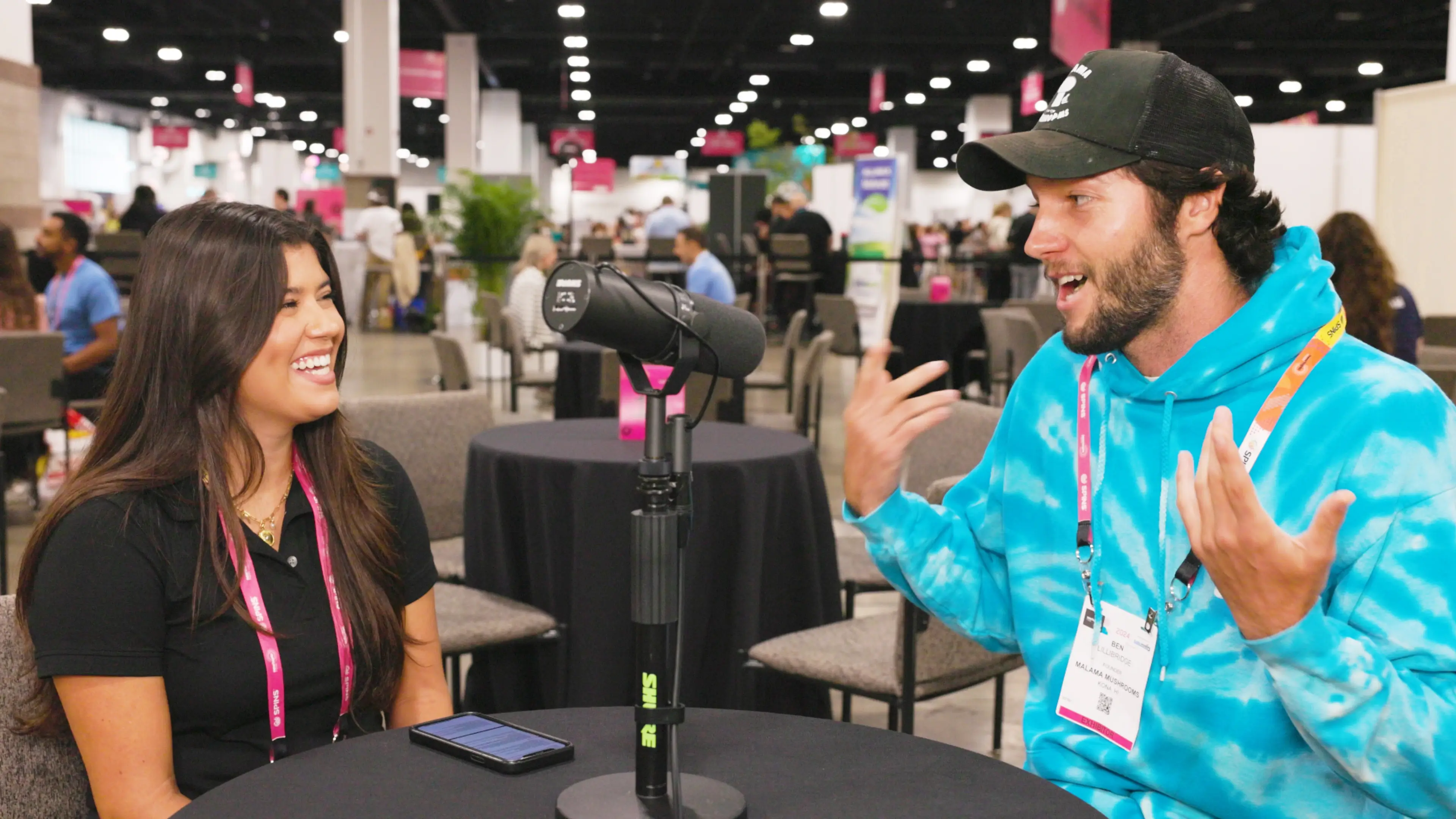 Amanda Marvin and Ben Lillibridge talking at a table